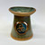 Oil Burner  Handmade and Crafted in a textured stoneware clay, carrying a tri-spiral motif and finished with stoneware glazes.