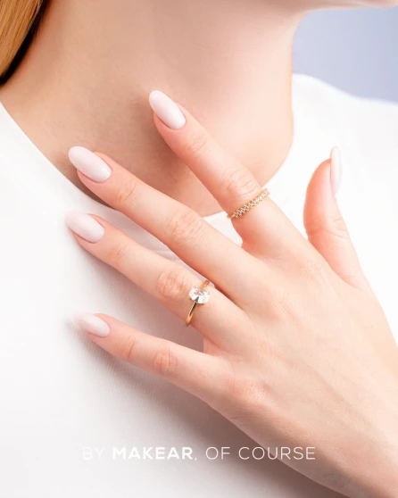 Elegant French manicure featuring a soft, semi-transparent milky nail base and delicate white French tips for a clean, natural-looking finish.