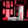 YOSHI Busy Signal 283 gel polish bottle with coral swatch