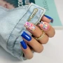 YOSHI Next Destination 288 blue manicure with floral accent nail