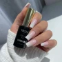 YOSHI Shimmer Top Silver on white square nails with product bottle