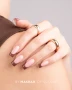 Close-up of a professional French manicure with glossy chocolate brown tips and natural pink nail bases. The long square nail shape highlights the rich brown colour and clean French tip detailing.