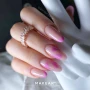 Professional manicure featuring neatly shaped nails painted in a pink shade, creating an elegant nail design inspired by Makear 600 Hybrid Gel Polish.