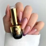 Professional manicure featuring neatly shaped nails painted in a beige shade with smooth, even colour coverage. The image showcases an elegant, neutral nail design inspired by Makear 613 Regular Hybrid Gel Polish, suitable for minimalist and everyday salon styling.
