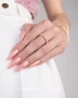 Creative neutral manicure featuring beige gel polish with fine multicoloured glitter, combined with complementary nude and milky white nail colours. The delicate decorative accents create an understated, elegant design suitable for minimalist and office-inspired nail styling associated with Makear 640.