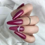 Elegant manicure featuring neatly shaped nails painted in a pink colour with smooth, even coverage and a glossy finish. The coordinated nail design creates a polished, feminine manicure inspired by Makear 704 Pink Hybrid Gel Polish, suitable for everyday wear and professional salon styling.