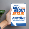 Person holding How to Talk About Jesus with Anyone, angled for easy reading.
