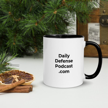 Close-up of the Daily Defense Podcast mug highlighting the white print area and sleek black interior color.