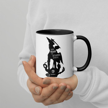 Ceramic mug on plain white background showing colorful rim, handle, and inside.