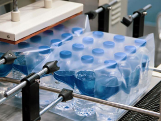Bottled water being shrink-wrapped