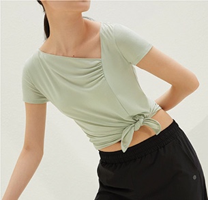Woman in green activewear top