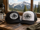 QuickHatch trucker hats in a rustic cabin setting