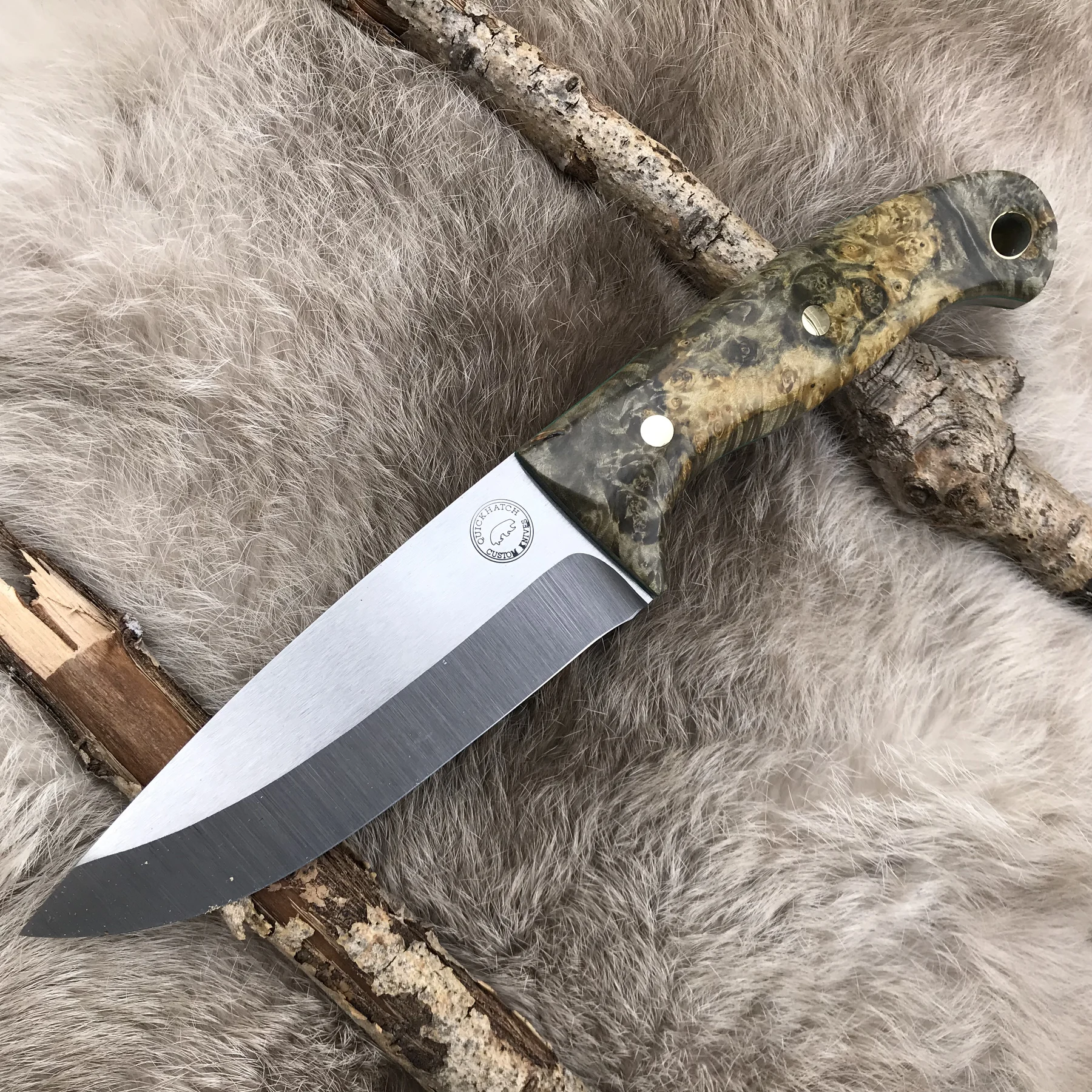 Bushman knife with green handle on fur