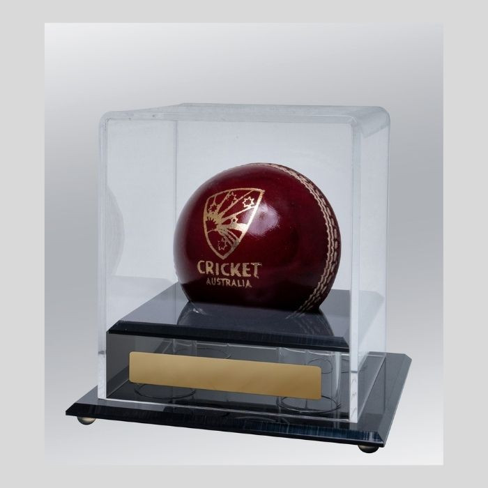 The Acrylic Ball Holder is a stylish and protective display case, perfect for showcasing cricket  memorabilia. Designed with high-quality clear acrylic, this holder provides a sleek and professional way to preserve and present special game balls, autographed collectibles, or milestone achievements.