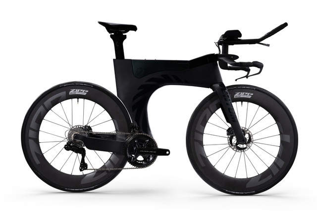 Side profile of the Ventum One Disc triathlon bike equipped with Shimano Dura Ace Di2, showcasing its aerodynamic frame, integrated hydration system, and deep carbon wheels.