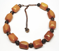 Choker necklace can be adjusted to desired length.