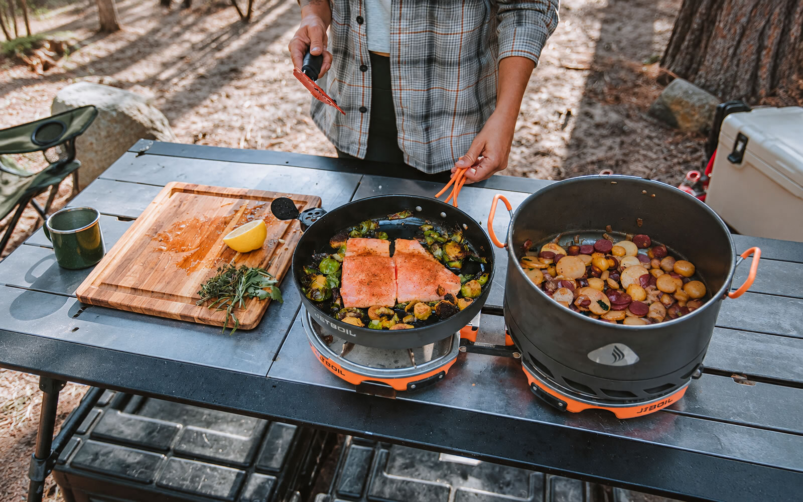 Jetboil Genesis stove cooking a meal at camp
