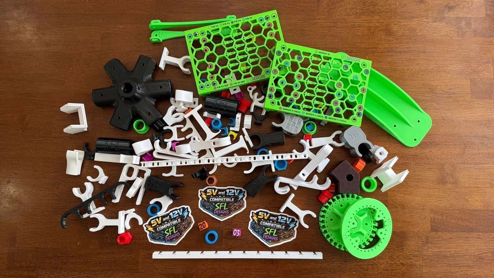 The SFL Designs product range laid out: controller port boards, clips, mounts, and adapters