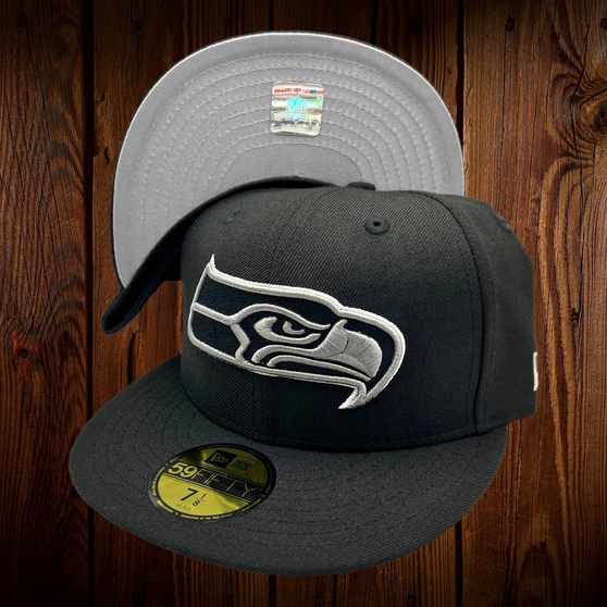 Seattle Seahawks New Era All Black With Silver Outline Around The Seahawk 59FIFTY Fitted Hat