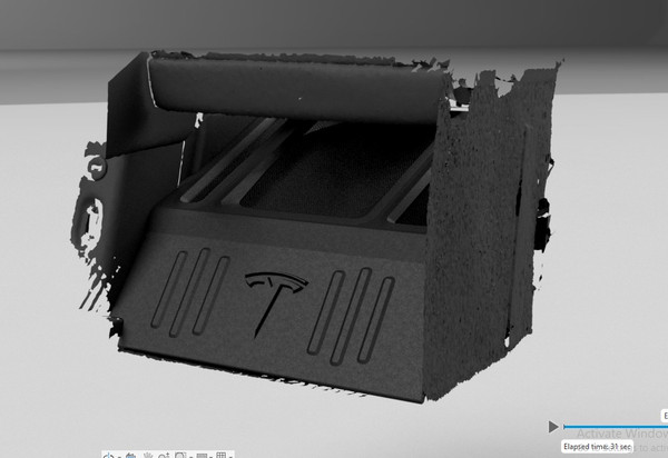Custom subwoofer enclosure designed in CAD around the Tesla Roadster 3D scan