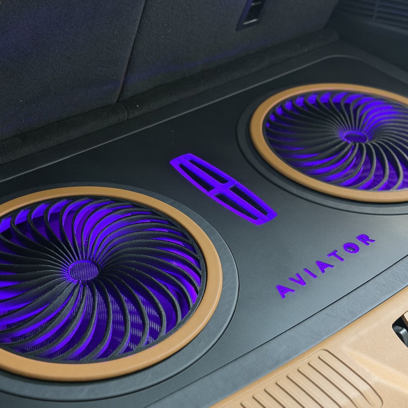 Backlit turbine subwoofer floor custom-built into a 2026 Lincoln Aviator at Audio Edge