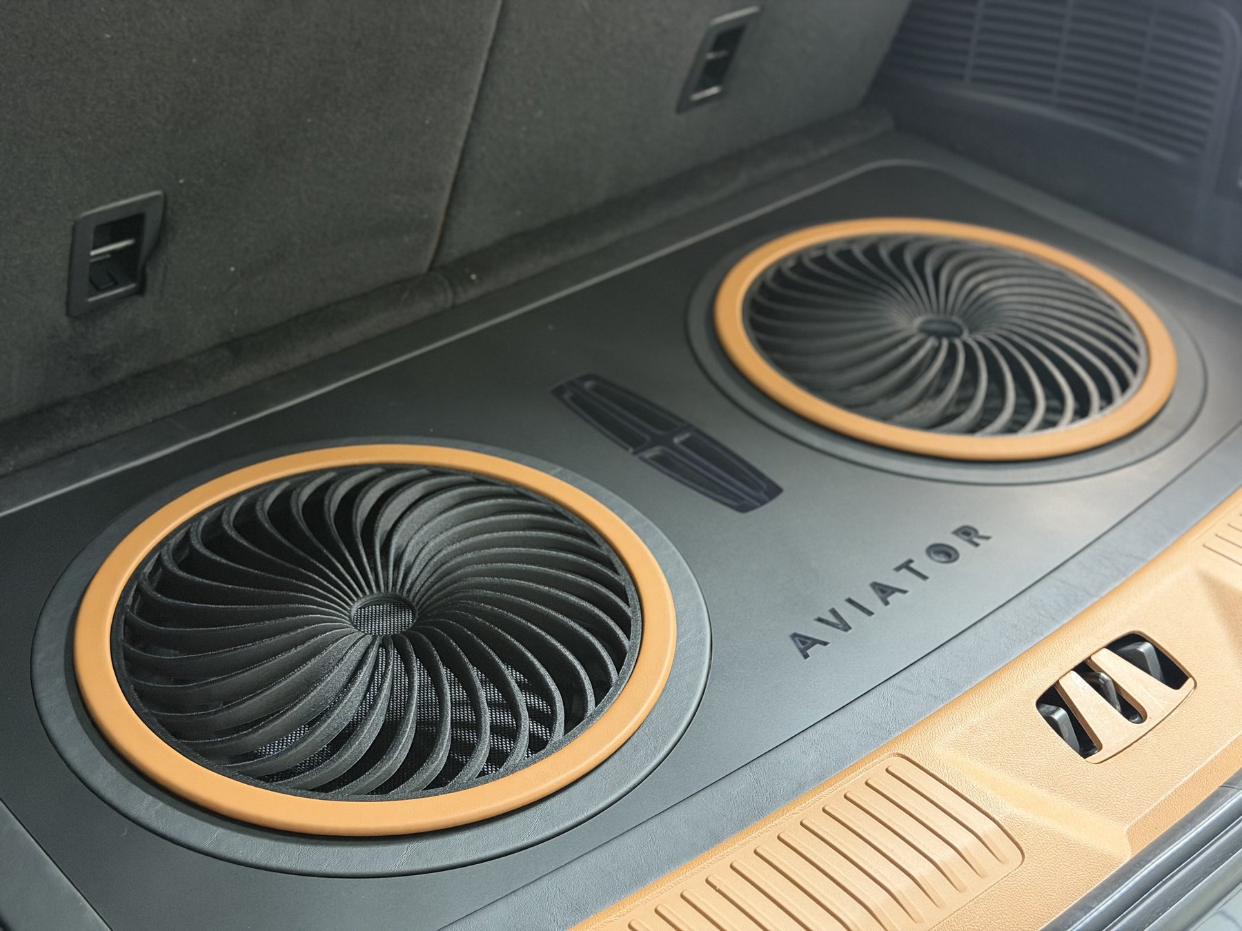 Turbine-grille subwoofer floor integrated into the factory cargo area of a 2026 Lincoln Aviator