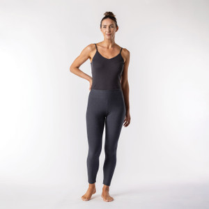Full body front view of model wearing heather grey solid color organic cotton fleece leggings. Full body front view of model wearing heather grey solid color organic cotton fleece leggings.