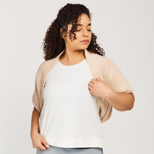 Model wearing the sand shell color organic cotton Sweater Infinity Scarf draped over the shoulders like a shrug top. Model wearing the sand shell color organic cotton Sweater Infinity Scarf draped over the shoulders like a shrug top.