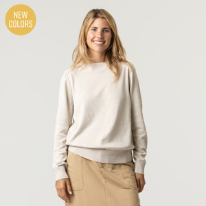 Front view of model wearing organic cotton classic crew sweater in color pearl. Front view of model wearing organic cotton classic crew sweater in color pearl.