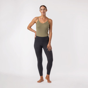 Model wearing heather grey color organic cotton ankle base layer leggings. Model wearing heather grey color organic cotton ankle base layer leggings.