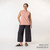 Full body view of model wearing organic cotton gaucho pant in color pepper.