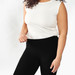 Model wearing black solid color organic cotton ankle base layer leggings.