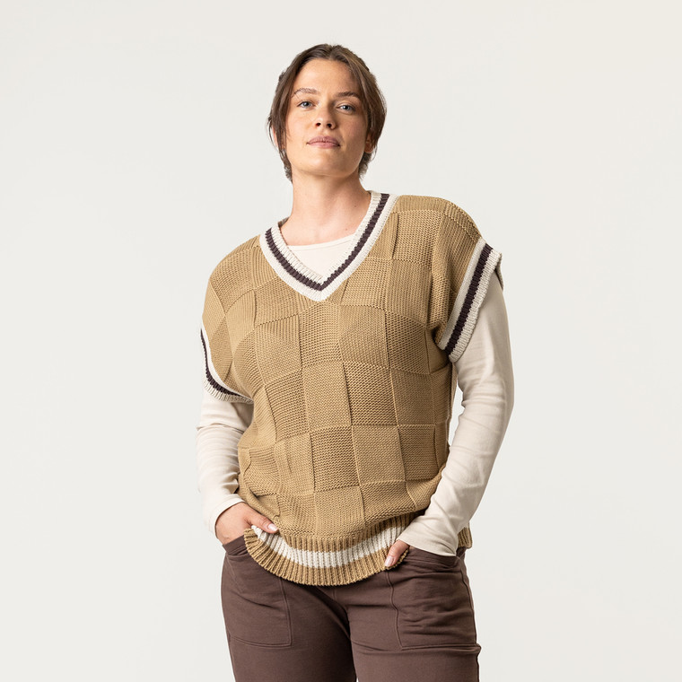 Front view of model wearing 100% Regenerative Organic Certified® Cotton sweater vest in color khaki