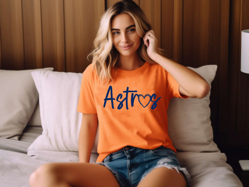 An orange t-shirt with the text "astros" printed onto the front.