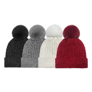 Women's Cable Chenille Beanie with plush lining and faux fur pom. One Size Fits Most. Assorted colors. Women's Cable Chenille Beanie with plush lining and faux fur pom. One Size Fits Most. Assorted colors.