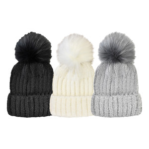 Women's Ribbed Beanie with oversize faux fur pom. One Size Fits Most. Assorted colors. Women's Ribbed Beanie with oversize faux fur pom. One Size Fits Most. Assorted colors.