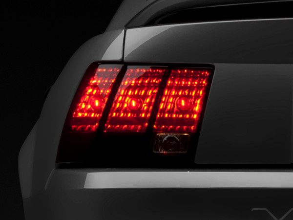Raxiom 99-04 Ford Mustang Excluding 99-01 Cobra Tail Lights- Black Housing (Smoked Lens) - 49080