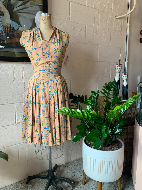 SOLD 1950's Tan w/ Clip art Scattered Dress