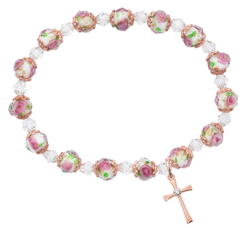 Rose gold cross bracelet with pink flower crystal beads and rose gold accent beads on white background