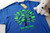 Family Tree on blue shirt with shades of green