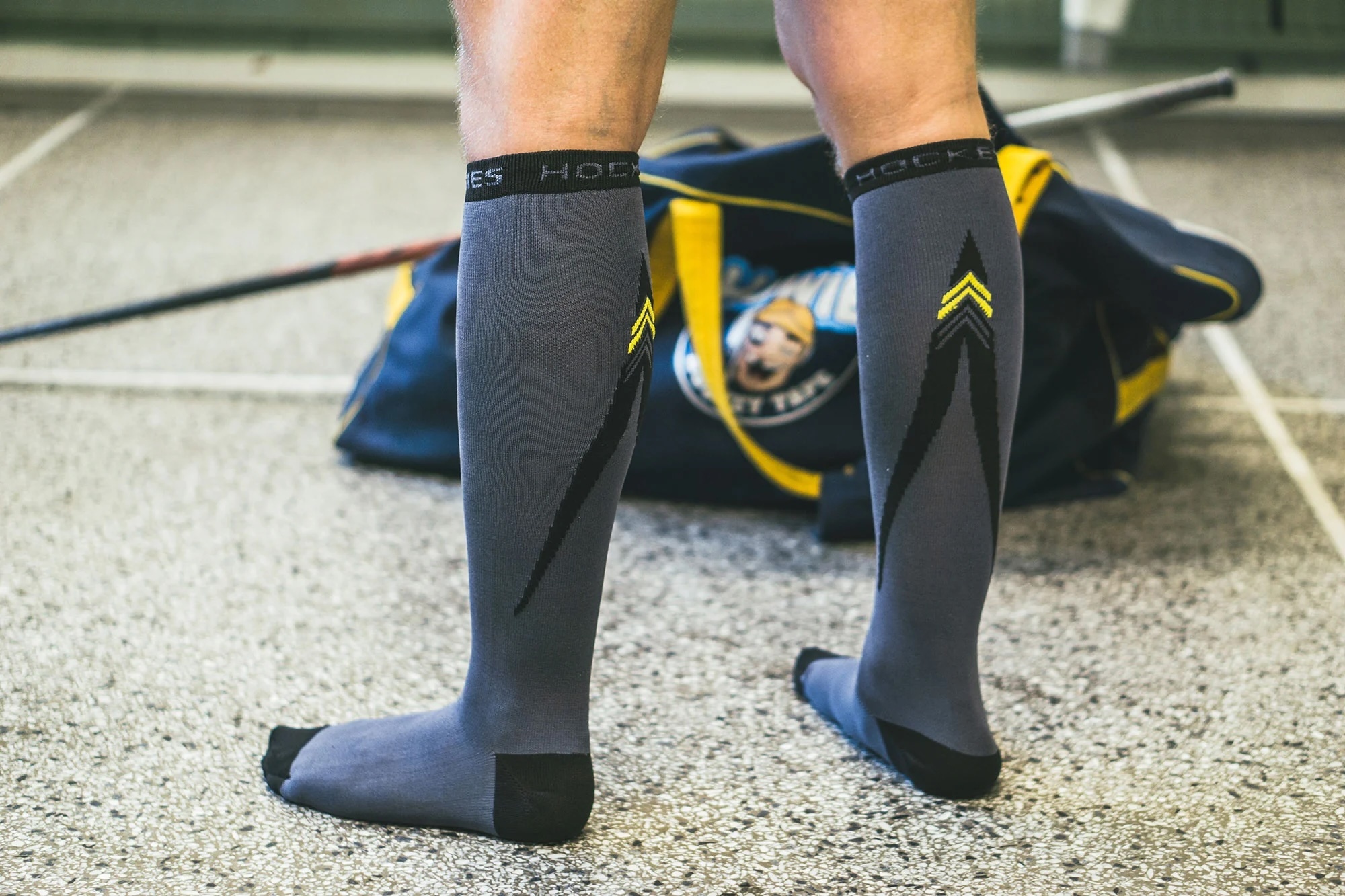 Dark colored hockey socks player in locker room