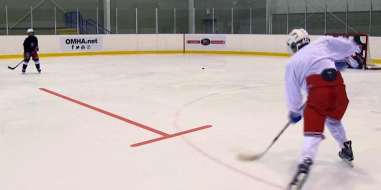Hockey players pracitcing on the ice