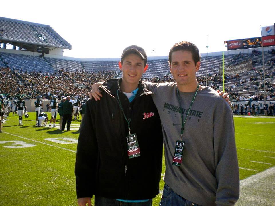 Figure 20 When Michigan State brought me on my visit there, they rolled out the red carpet bringing us [pictured here with my brother Brett] to the football game.