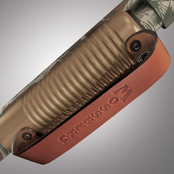 The leather-strapped forend keeps the lead hand clear of the muzzle when cycling the action, features a debossed Mossberg logo.