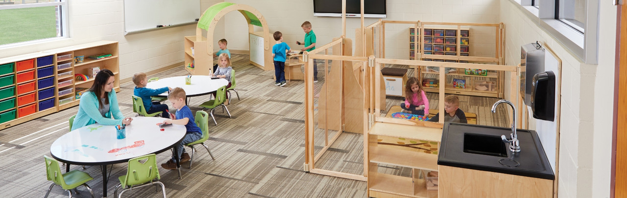 children using classroom furniture