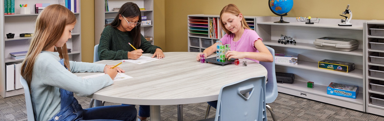 young teens using classroom table