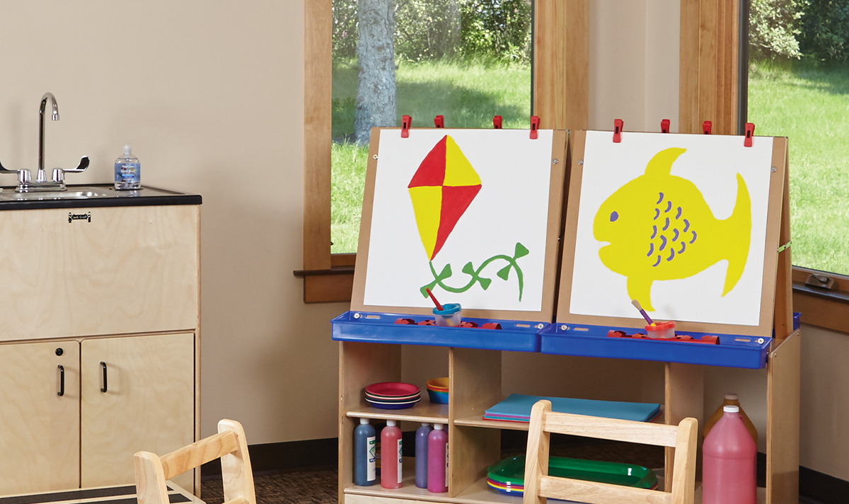 Jonti-Craft art easels with paintings on them