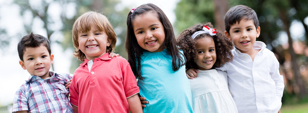 Group of 5 grade school children smiling