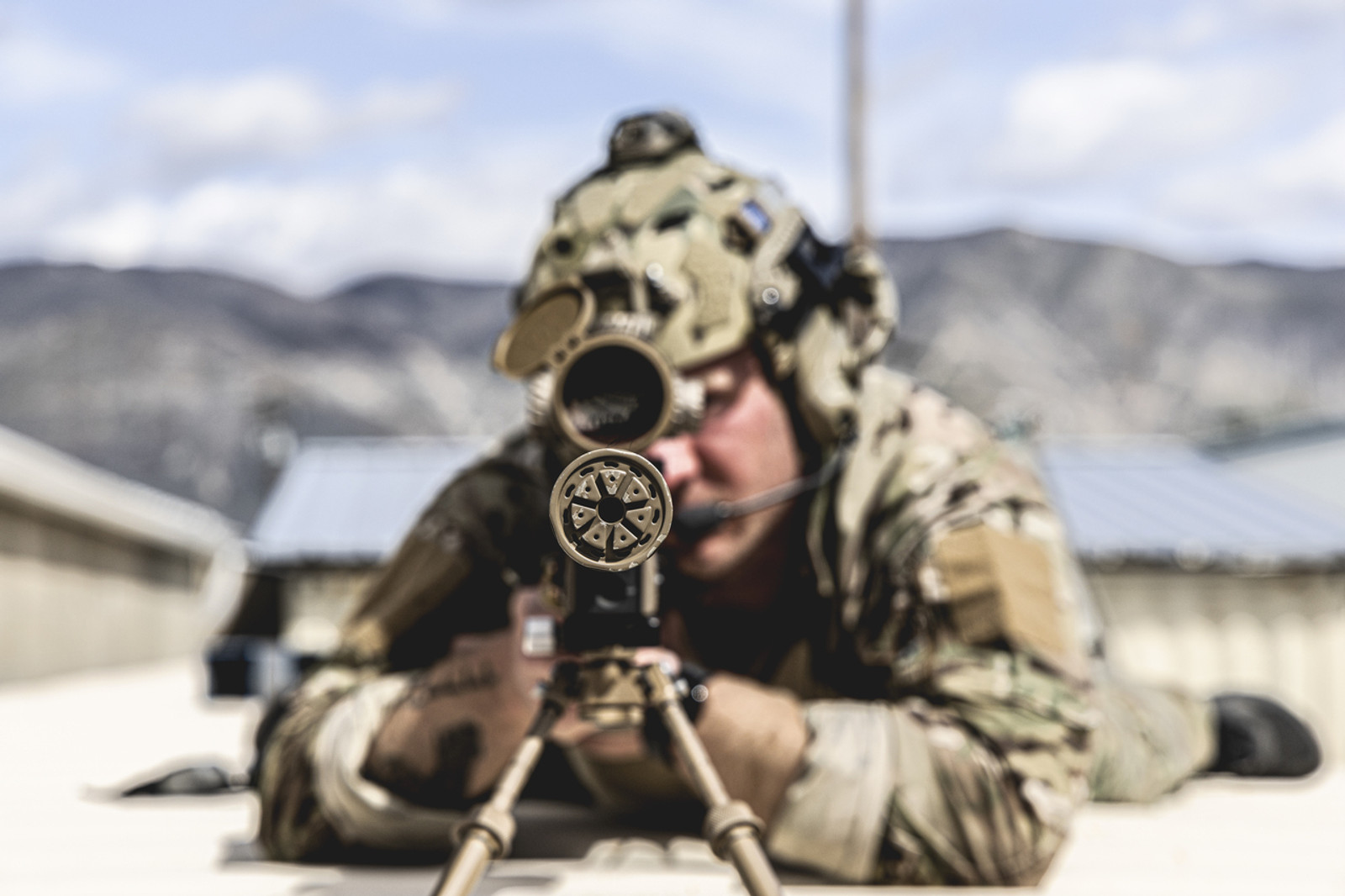 A picture of a soldier using the front end cap on a theorem suppressor