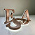 Side view backlit metal letter closeup